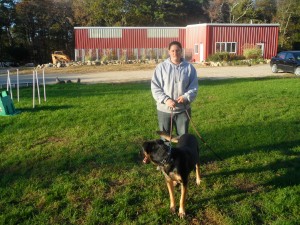 Dog trainer with dog on leash