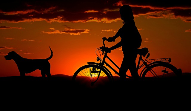 woman with bike and dog